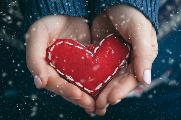 istock Female hands giving red heart. Close up. 1084870140