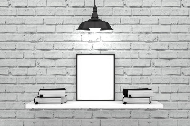 istock White brick wall and shelf with empty frame and old books 1084870752