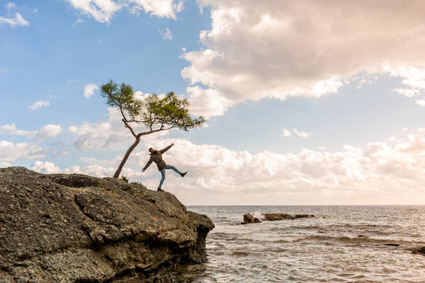 istock Lonely Man at Coastline 1084883222
