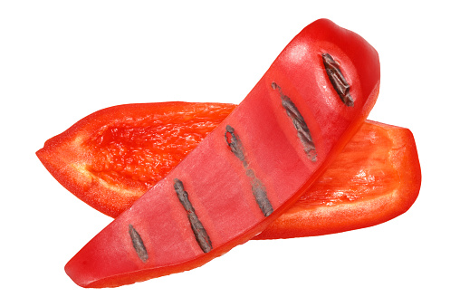 Grilled or fire roasted red bell pepper slices, top view