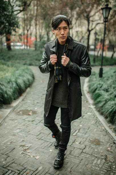 istock Handsome Asian man in black outfit 1084885756