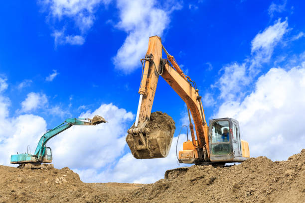 istock Excavator working at building site on sunny day 1084897076