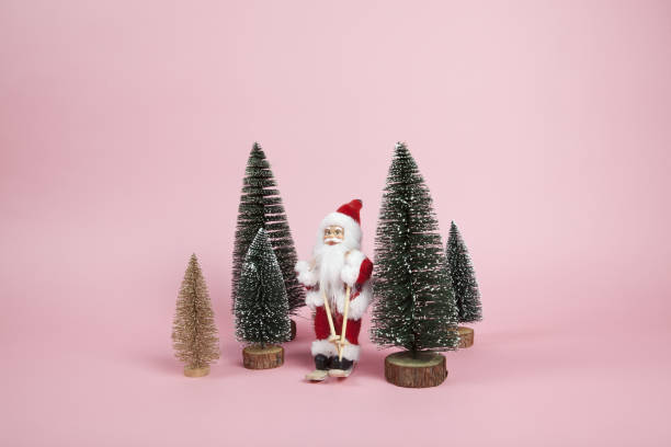Santa Claus skiing on a pink background