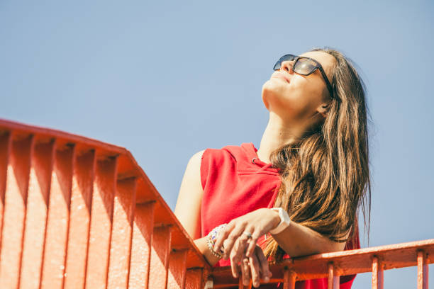 istock Girl on bridge in city. 1084903692