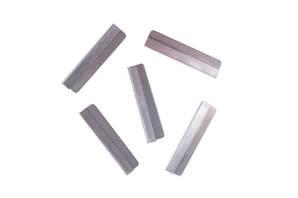 istock new razor blades arranged on a white background. 1084903734