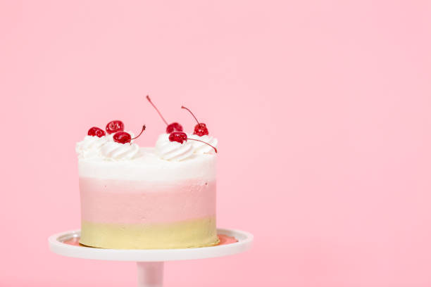 istock Birthday Spumoni cake on pink background. 1084915392