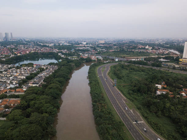 River and roadside Aerial view of river and roadside with hazy sky. tangerang photos stock pictures, royalty-free photos & images