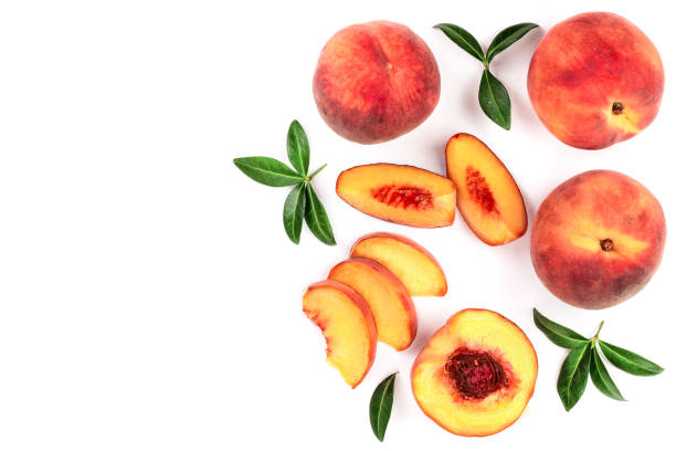istock ripe peaches with leaves isolated on white background with copy space for your text. Top view. Flat lay pattern 1084916554