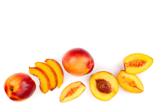 istock ripe nectarine with leaves isolated on white background with copy space for your text. Top view. Flat lay pattern 1084916618