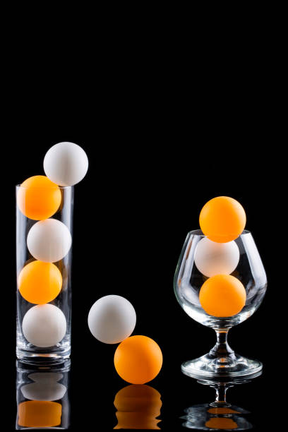 istock Still life with glasses, balls and reflection 1084925400