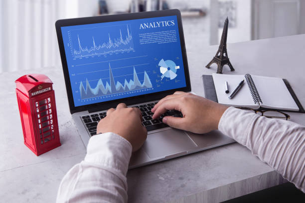 Top view of a businessman laptop computer with analytics data concept on screen. Working with financial graphs charts, using business software for data analysis and project management concept