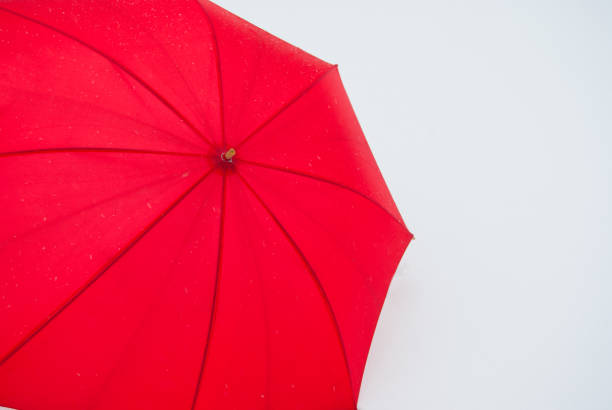 istock Single red umbrella seen from above 1084926488