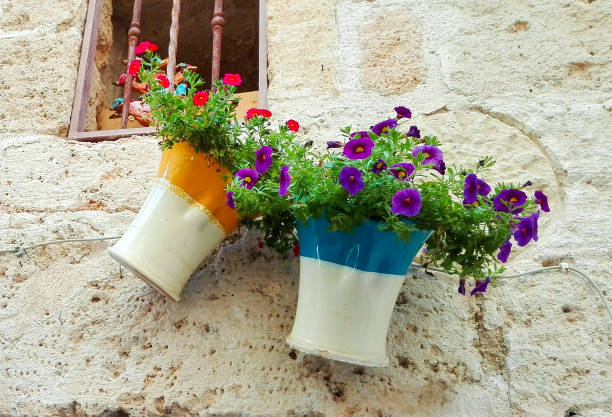 istock Two vases of earthenware glazed with flowers 1084926502
