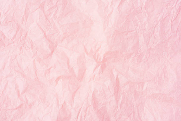 istock Crumpled pink paper or pink paper texture pattern background. 1084926760