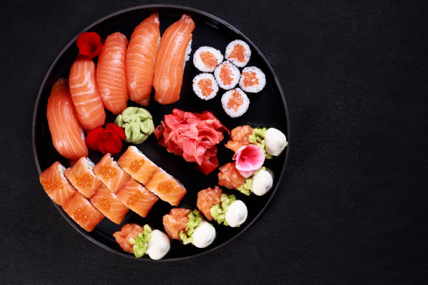 nigiri sushi and maki rolls set on round plate