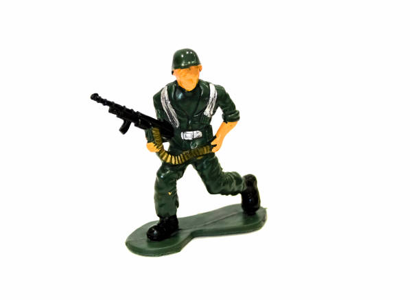 istock miniature toy soldier on white background, close-up 1084933672