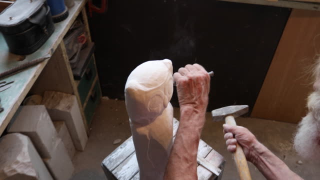 Stone cutter at craft workshop