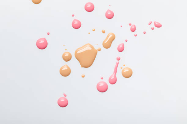 istock top view of abstract pastel nail polish with drops isolated on grey 1084934896
