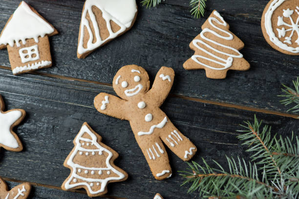 istock gingerbread gingerbread different shapes on a wooden table 1084935012