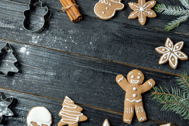 istock Christmas gingerbread cookies on wooden table with copy space 1084935068