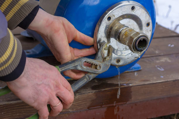 istock locksmith plumber repairing the water system expansion tank 1084943084
