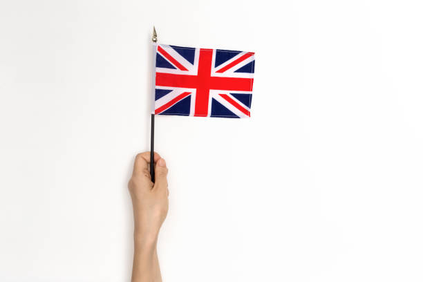 istock Person holding the UK Flag 1084949282