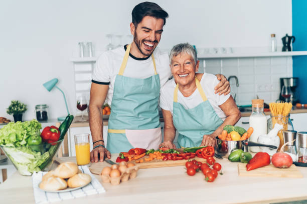 istock Mon and son having good time in the kitchen 1084953400