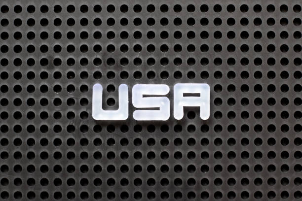 istock Black color pegboard with white letter in word USA (abbreviation of United States of America) 1084957620