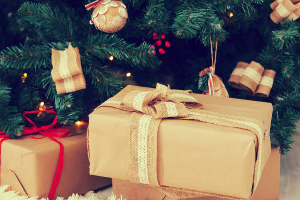 istock Boxes with gifts lie under a New Year tree 1084971452
