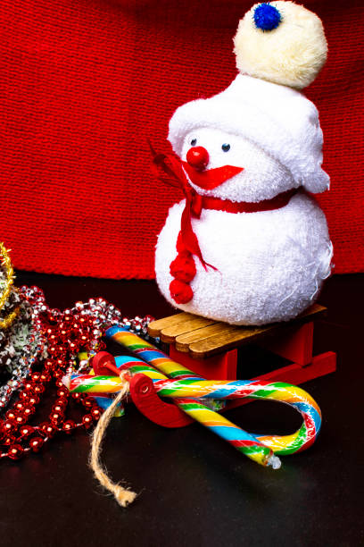 istock Christmas interior with decorative snowman, candy canes, garland. New Year winter composition. 1084971612