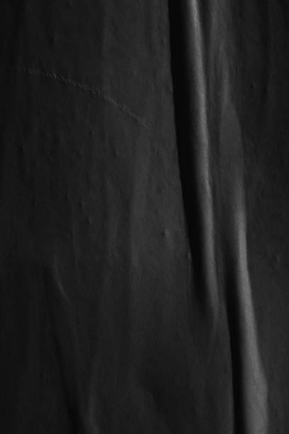 istock Dark black blank paper backgrounds creased crumpled surface old torn ripped posters grunge textures placard 1084973730