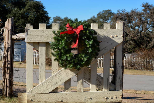 istock Christmas wreath hanging on a fence 1084974008