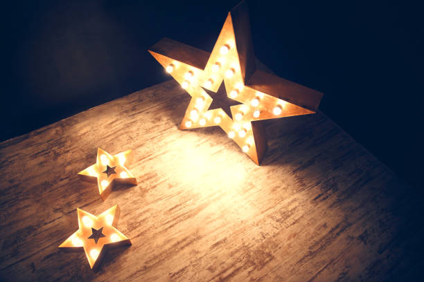 istock Three stars of light bulbs. Two horizontally one is vertical. 1084974036