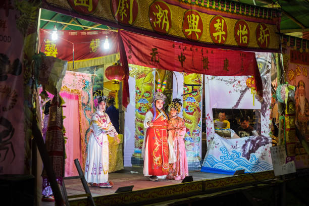 Teochew Opera During Hungry Ghost Festival Shot of a Teochew Opera Troupe performing during the Chinese Ghost festival. singapore hungry ghost festival stock pictures, royalty-free photos & images