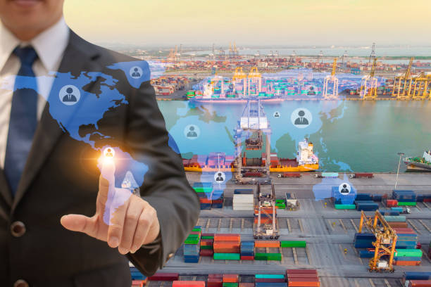 istock Businessman touching icon people on earth world map for network connection,on Logistics and transportation of International Container Cargo ship in the ocean background,Transportation, Shipping. 1084974616