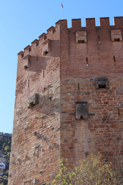 istock Bedesten Alanya fortress. Big red bricks tower. Turkey. 1084976124