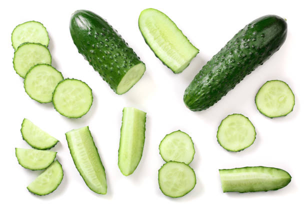 istock Cucumber slices isolated on white background. Top view. Flat lay pattern. Set or collection 1084978242