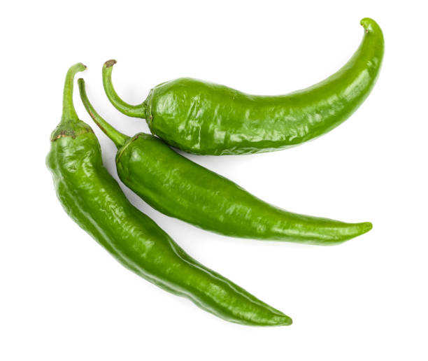 istock green hot chili peppers isolated on white background. Top view. Flat lay pattern 1084978276