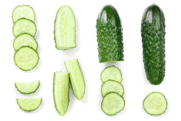 istock Cucumber slices isolated on white background. Top view. Flat lay pattern. Set or collection 1084978352