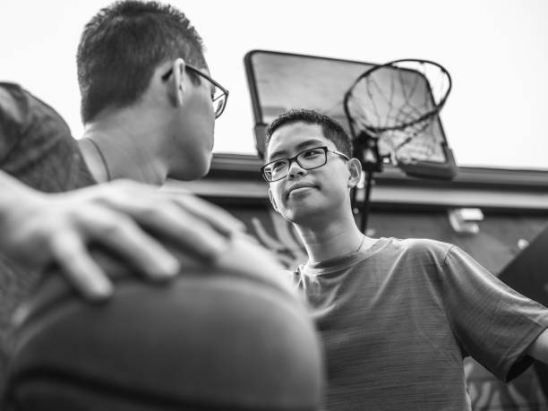 istock Twins at basketball 1084978532