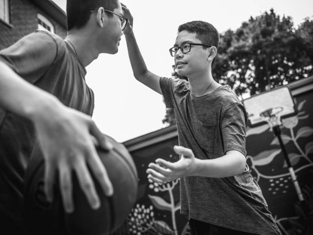 istock Twins at basketball 1084978706