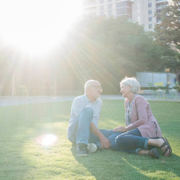 istock Couple relax in city park 1084979140