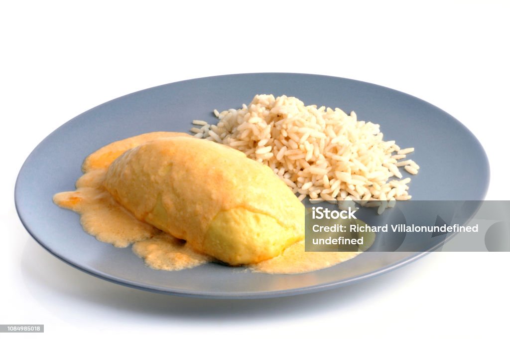 Plate of quenelle and rice Plate of quenelle and rice on a white background Cut Out Stock Photo