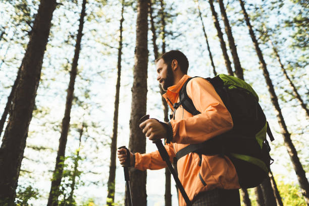 istock Tourist man hiking in the mountain 1084986076