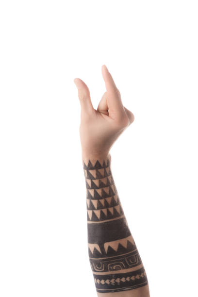 istock partial view of tattooed man showing size gesture with hand isolated on white 1084988604