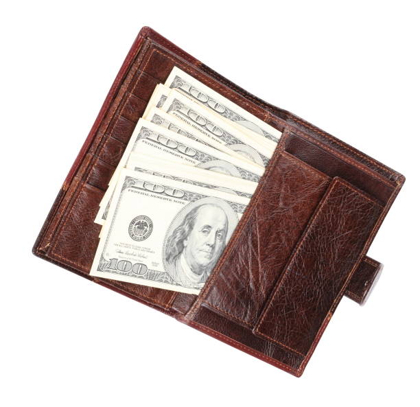 istock Leather Purse with dollars Isolated 1084988666