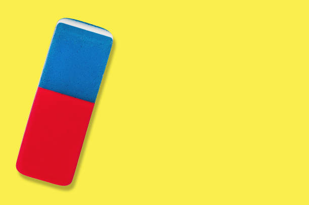 istock Single rectangular rubber eraser for pencil and pen ink on yellow background with copy space for your text 1084991644