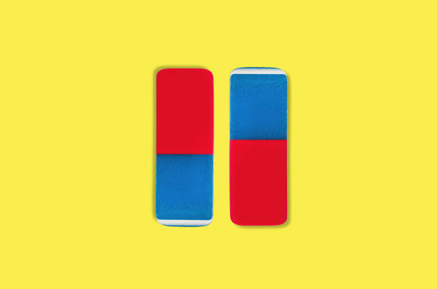 istock Pair of rectangular rubber erasers for pencil and pen ink in center on yellow background 1084991678