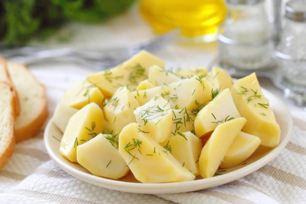 istock Boiled potatoes with greens and oil 1084993208