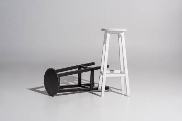 istock black and white wooden chairs with shadow on white 1084995192